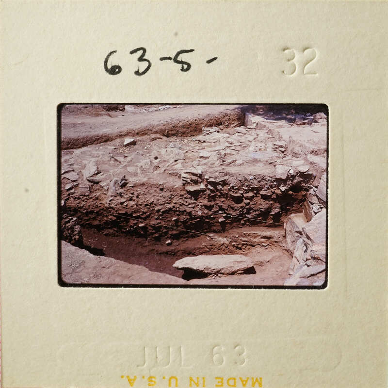 Old photograph showing excavated ruins with visible stone and dirt structures.