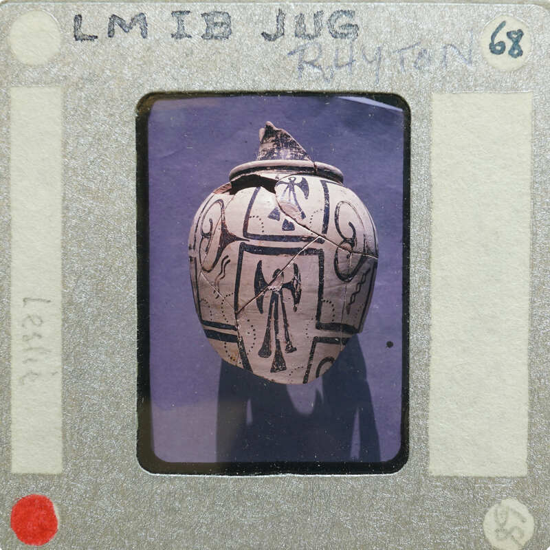 A photograph of an old juig with a cross design