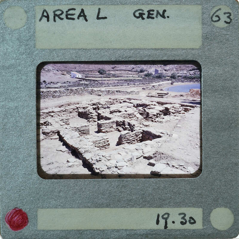 The image is a photograph of an old, dilapidated building or ruins with a vintage film strip border and label indicating it as "Area L Gen."