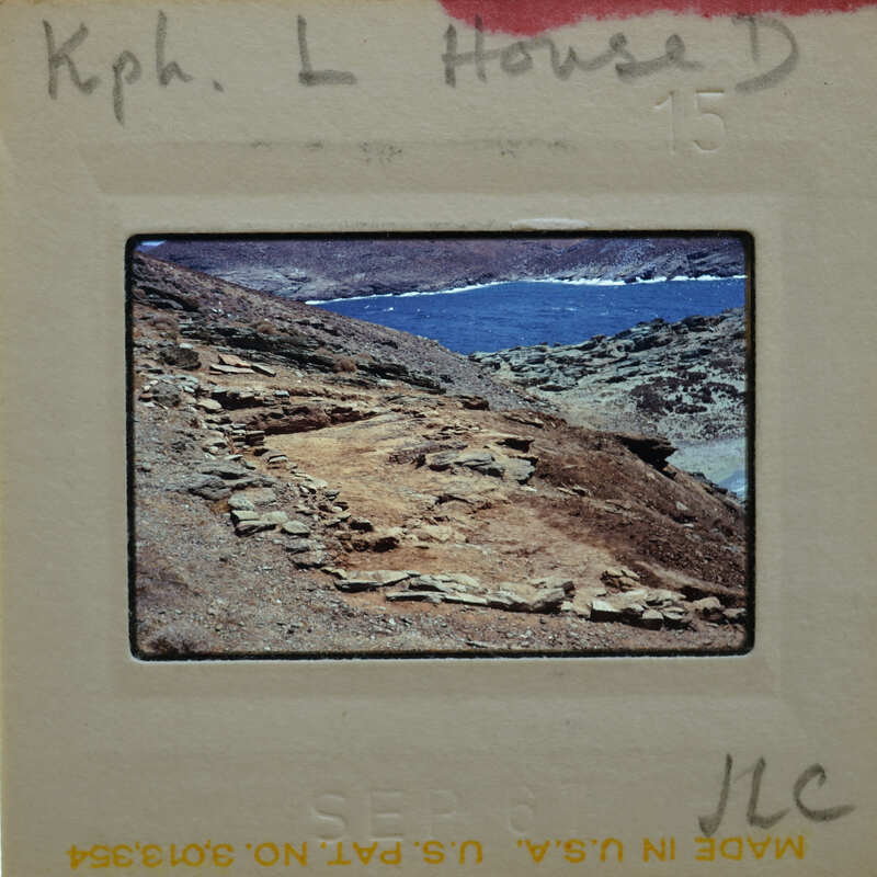 A photograph of a rugged coastline with rock formations and the sea.