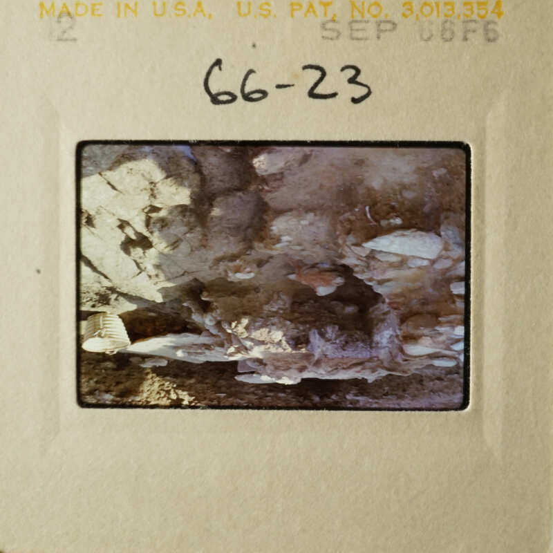 The slide shows an underwater view of a rocky cave with stalactites and stalagmites.