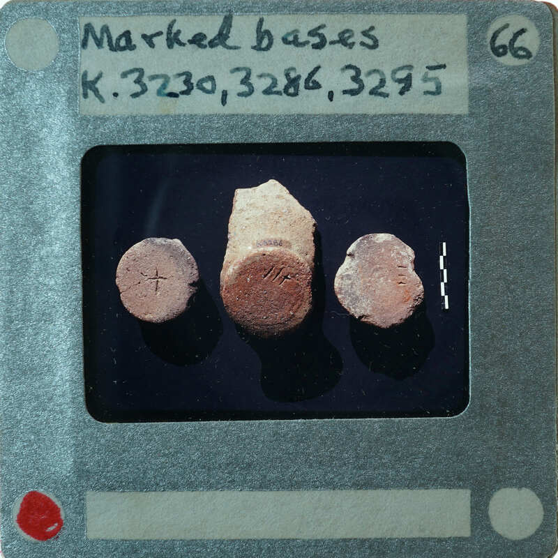 Three circular pottery bases with letter carvings, K.3230, K.3286, K.3295.