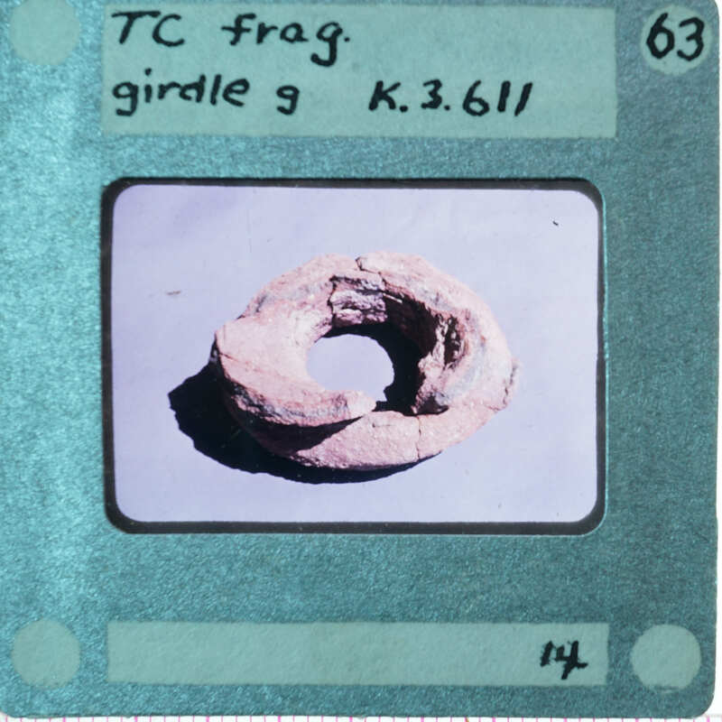 Ring shaped fragment of terracotta figurine.