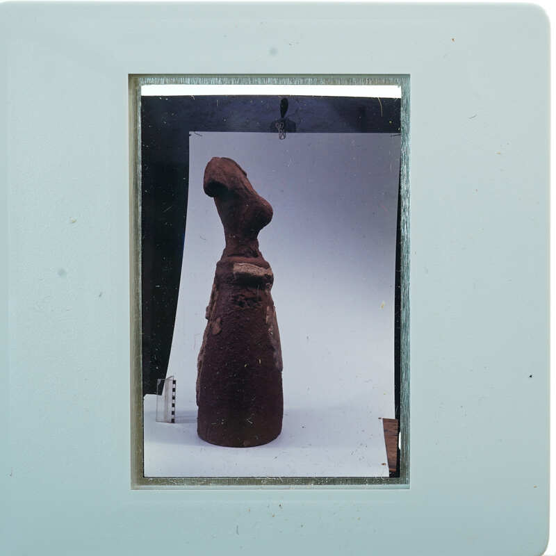 Terracotta figurine from the side.