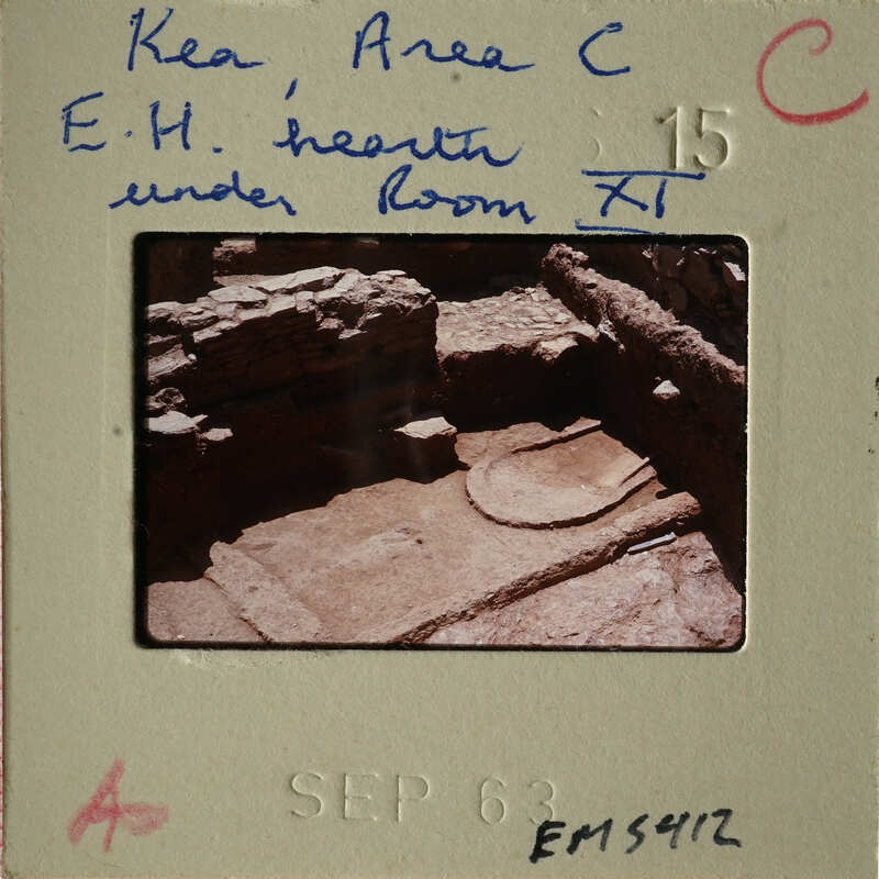 Ancient ruins with visible stone structures and markings, possibly from an archaeological site.