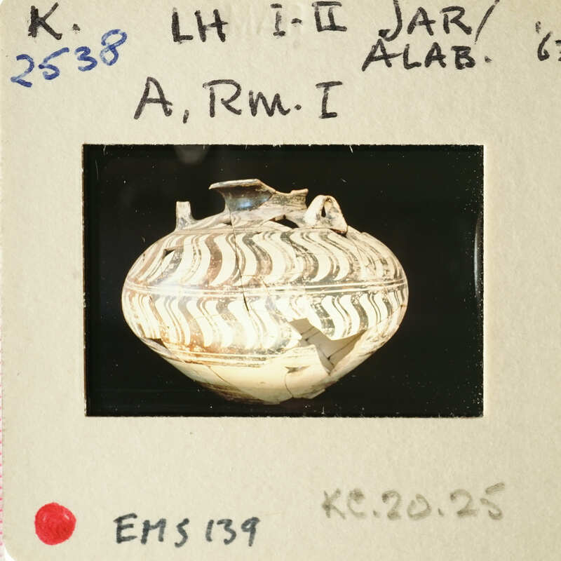 Ancient Greek vase with intricate patterns and designs, photographed on a white background.