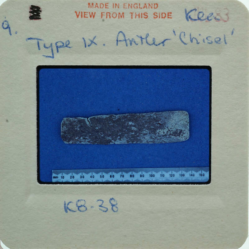 Rectangular object on blue surface.