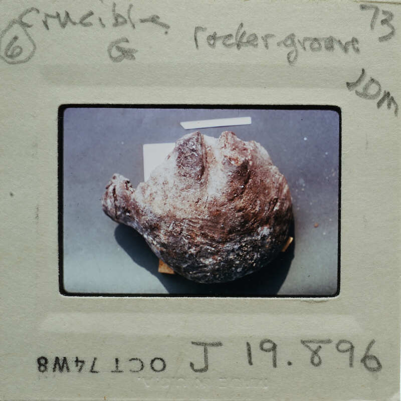 Half-dome stone object on surface.