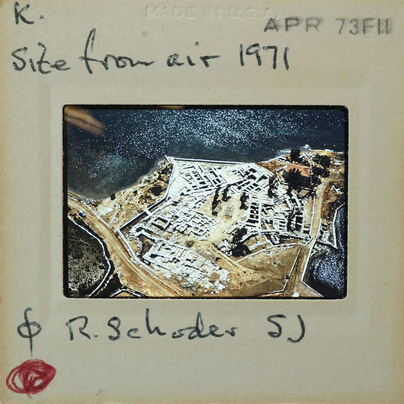 Aerial photograph of a historical site with handwritten notes on the frame.