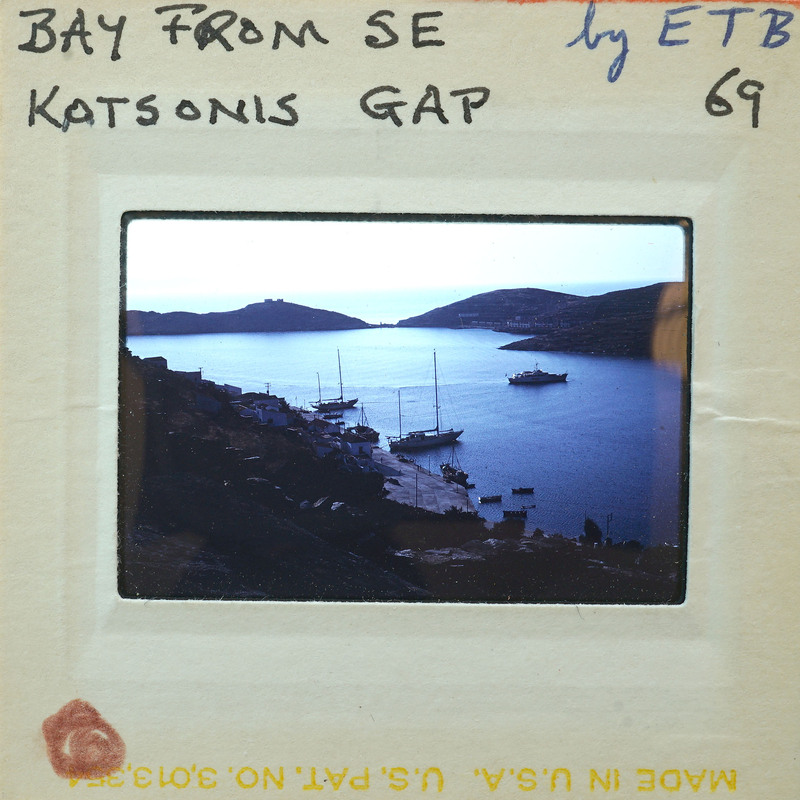 Photo of a harbor with boats and hills.