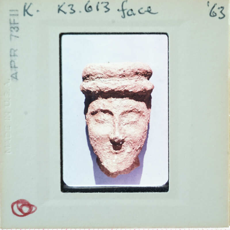 Terracotta face of figurine.