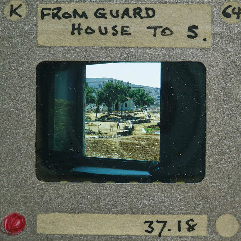 A vintage film strip with a picture of an old guard house on it.