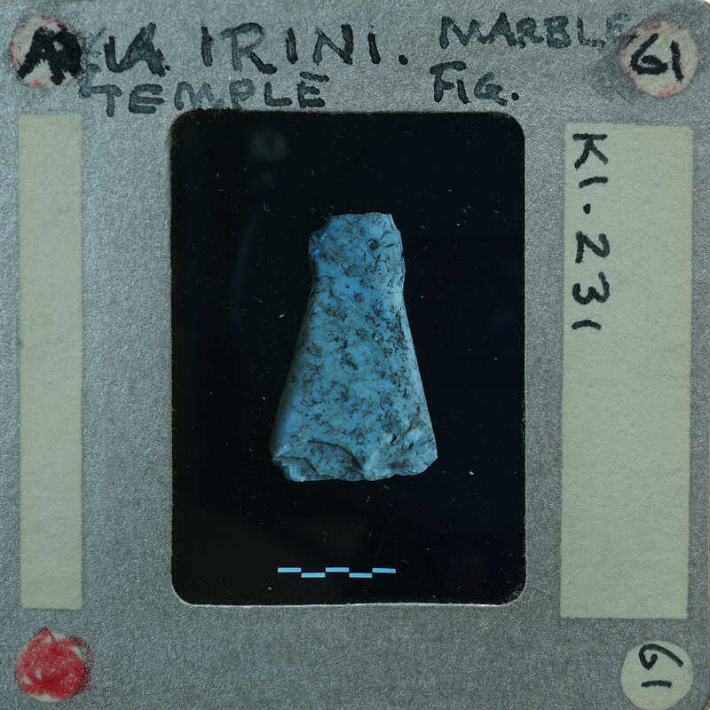 A small blue and black stone artifact.