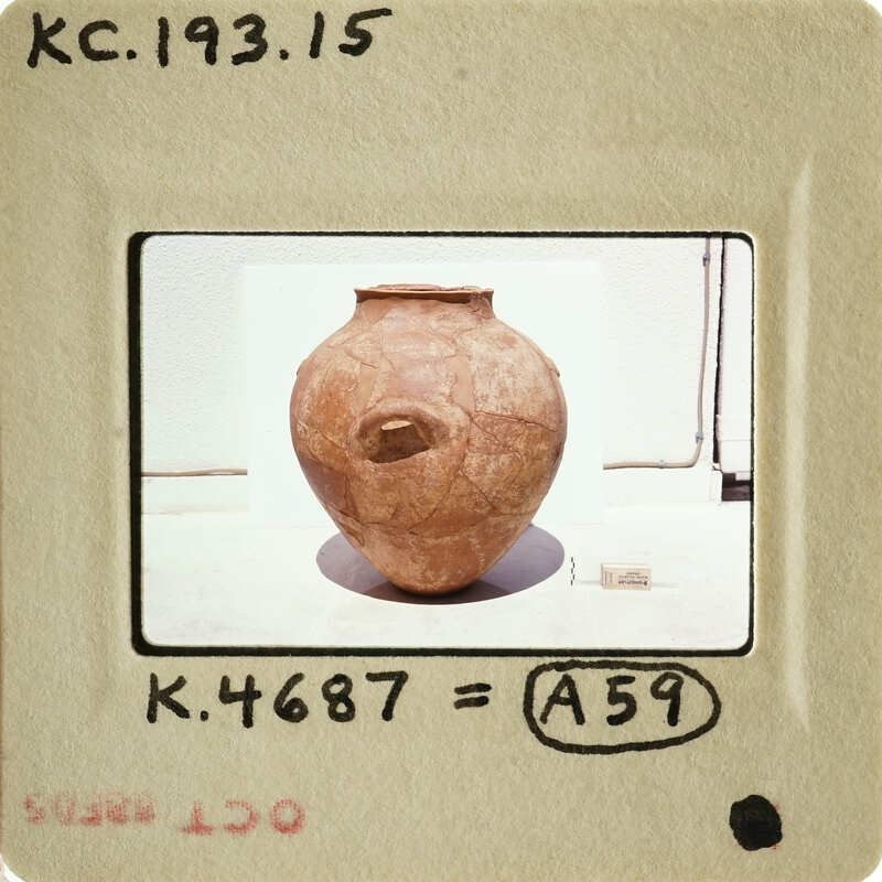 Brown clay pot with visible texture on display.