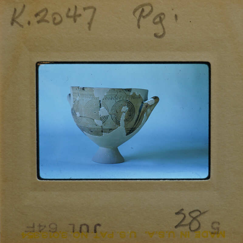 Reassembled bowl with swirl design in profile, K.2047.