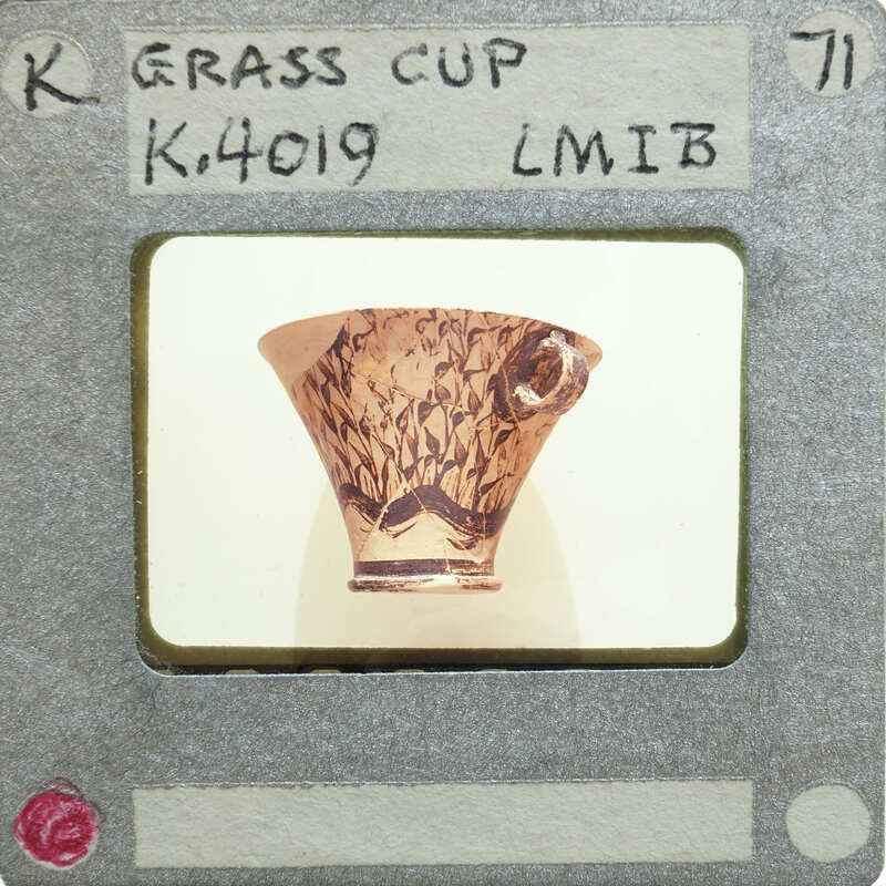 A photograph of a decorative ceramic cup (K.4019) with an intricate design on it.
