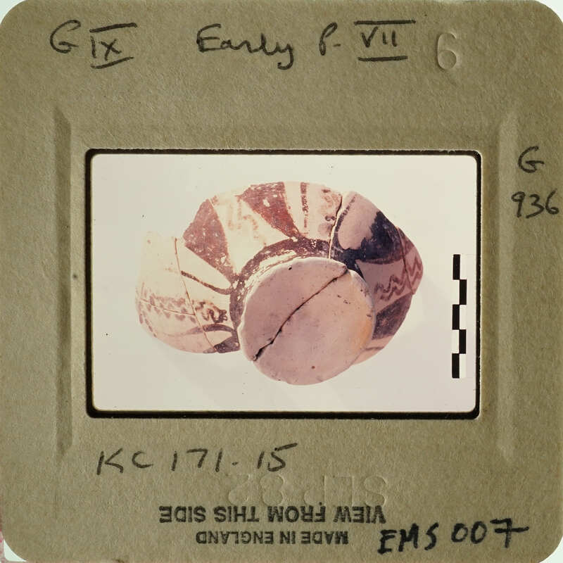 A photograph of an ancient artifact, possibly a piece of pottery with intricate designs.