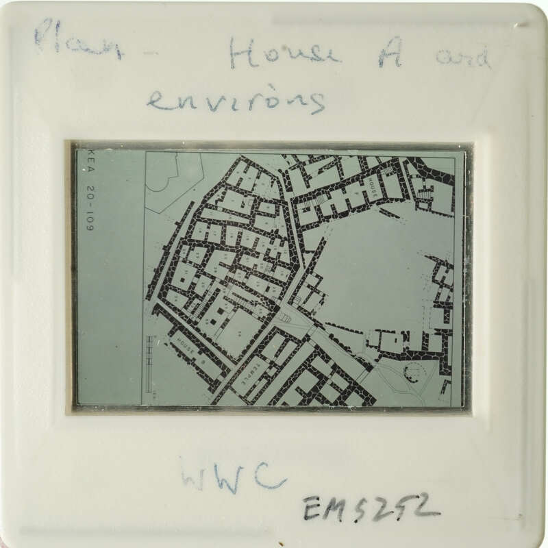 Black and white map of a city with handwritten notes on a transparent surface.