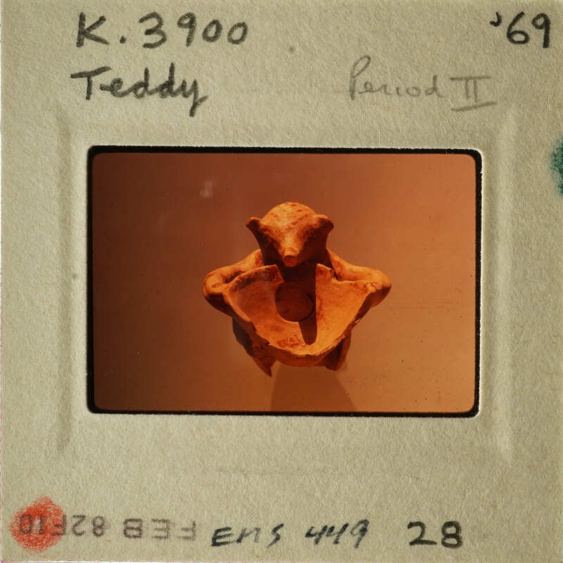 Old photograph of an ancient sculpture, possibly from Egypt, with visible damage and missing parts.