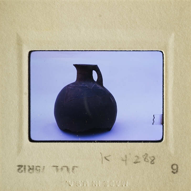 Brown clay pottery on white surface.