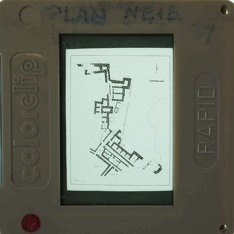 Black and white map of a complex with labeled rooms and pathways.