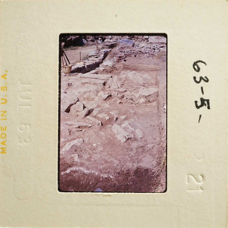 Ancient ruins with dirt and rocks, possibly from an archaeological site.