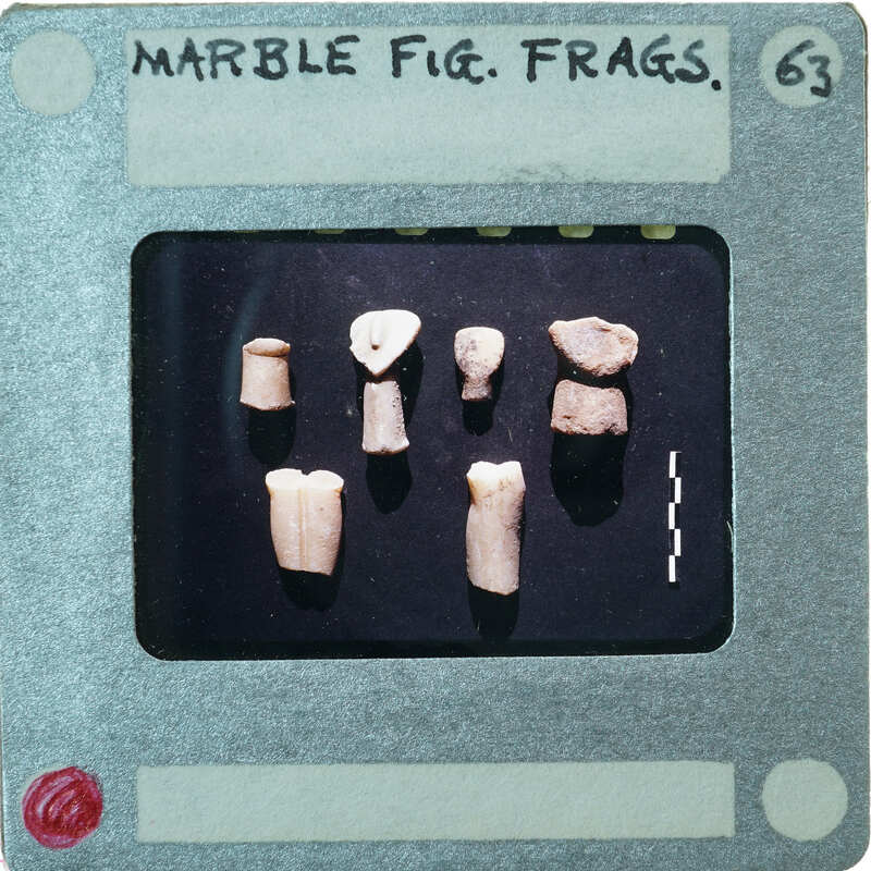 Eight pieces of stone showing variety of marble figurine fragments.