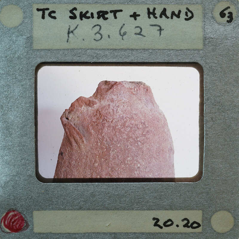 A photograph of a rock with an unusual shape, displayed on a film strip.