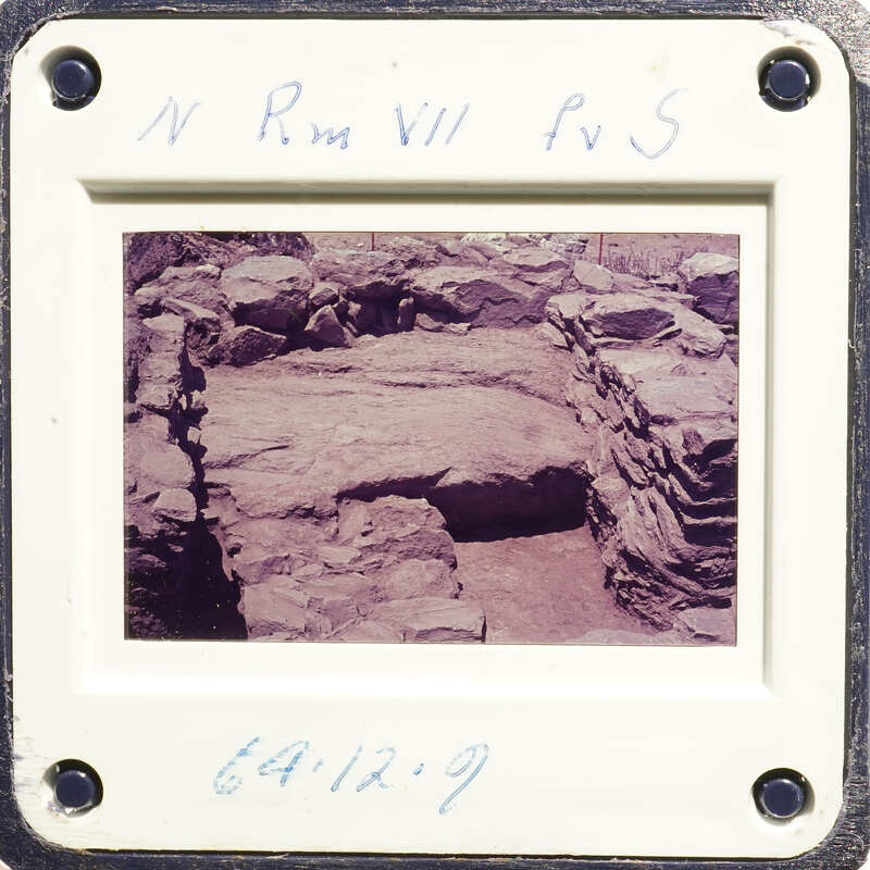 Ancient ruins with stone columns and walls, captured on an old photograph.