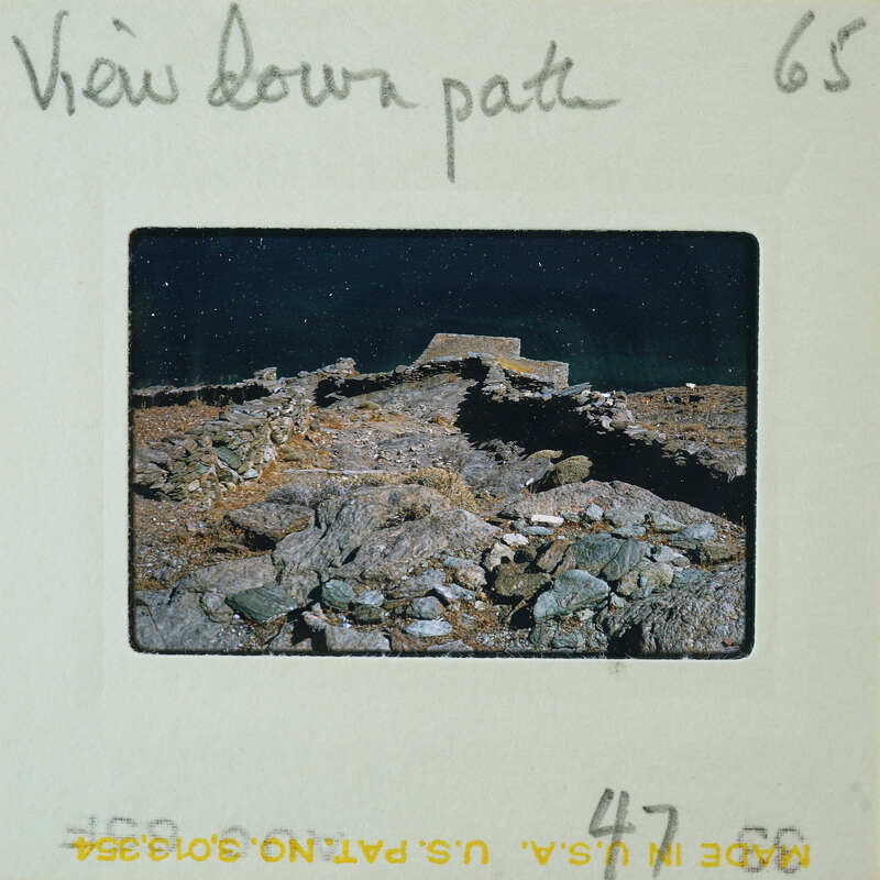 A photograph of a rocky landscape with a view down a path, on a film strip labeled "VIEW DOWN PATH."
