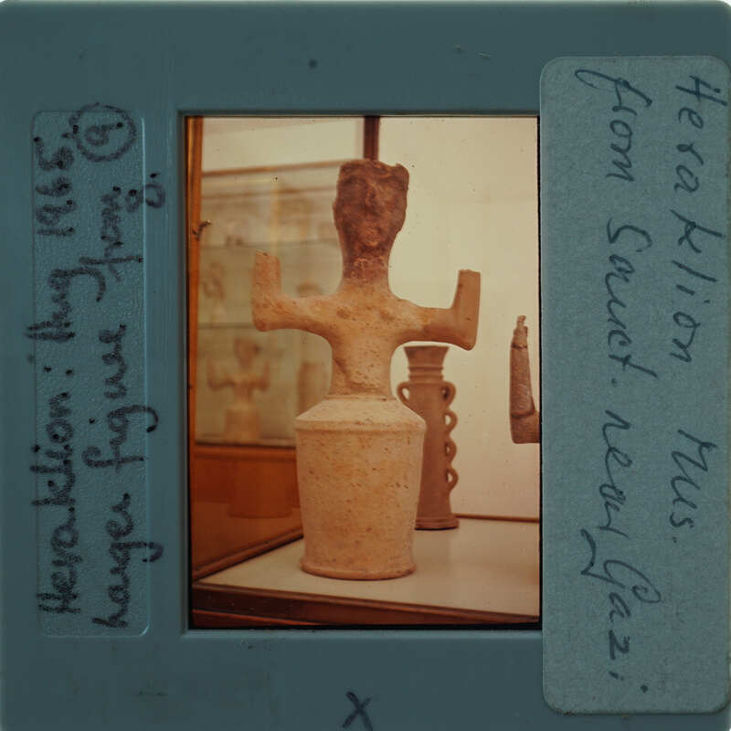 A photograph of an ancient artifact, specifically a stone sculpture, displayed in a museum setting.