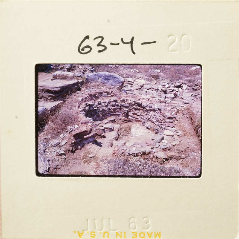 Archaeological site with ancient ruins and stone structures.