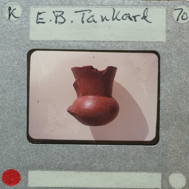 An old, damaged clay pot on a film strip.