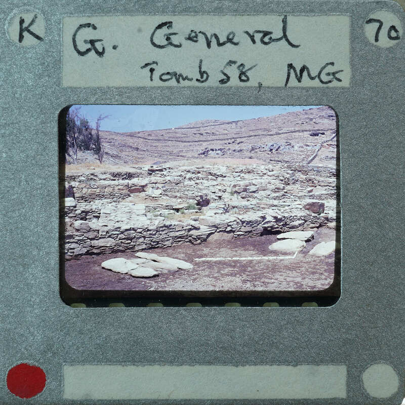 The image is a photograph of an old, possibly historical building or ruins, taken from the perspective of a film strip with a label that reads "CG GENERAL TOMB 58 MGC" and has a number "70"