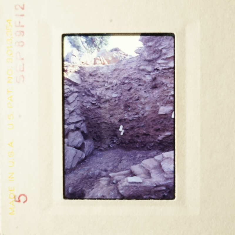 This is an image of a dirt pit with rocks and debris, taken from an elevated angle.