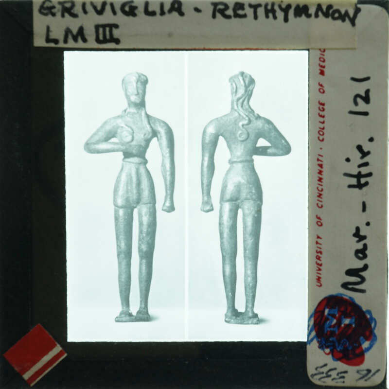 Black and white image of a figurine with two different views, front and back, on a museum card.