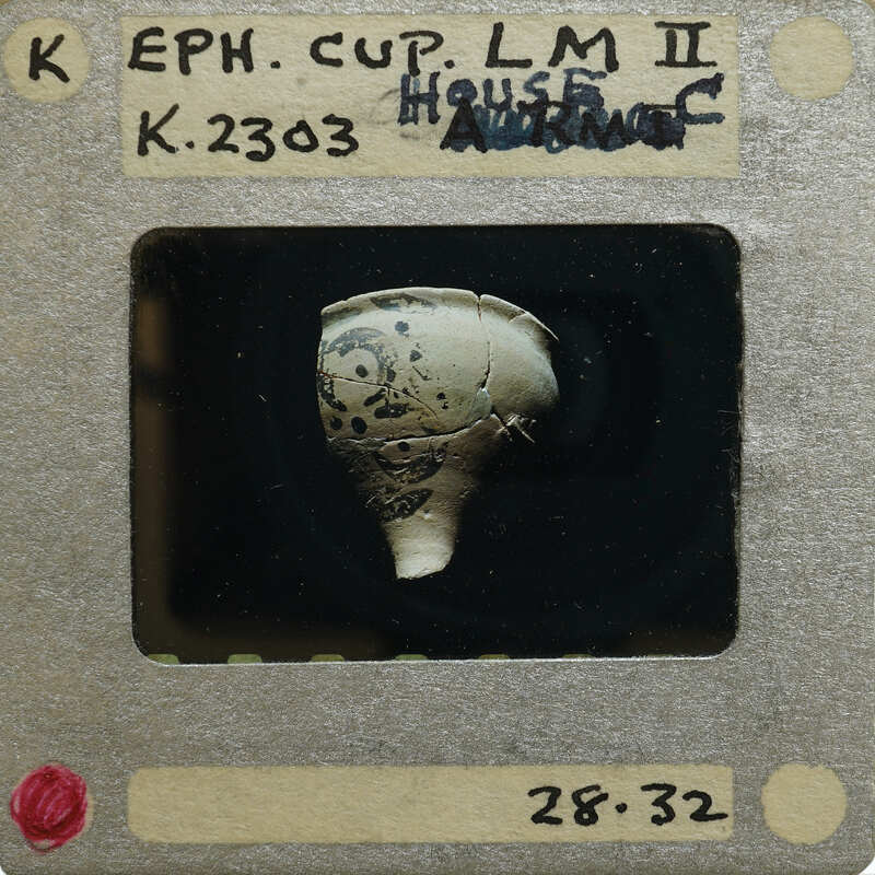 Partially complete cup (K.2303) with painted decorations.