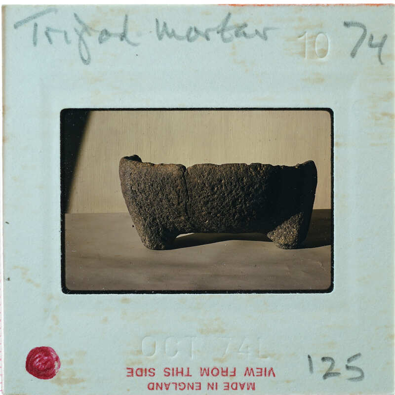 Profile of stone bowl with legs.