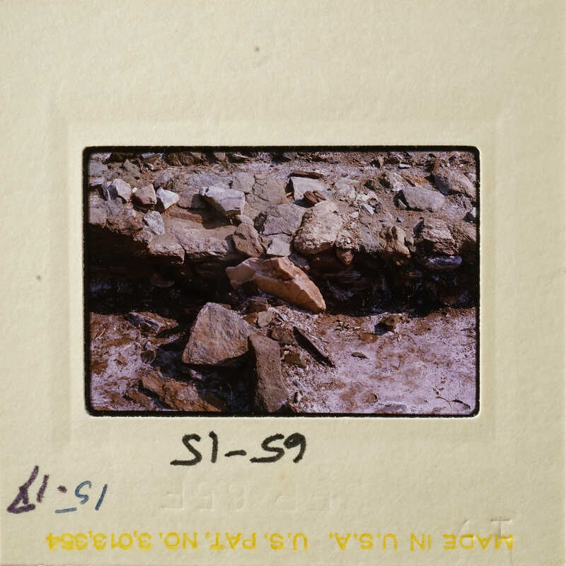 Rocky terrain with various sizes and shapes of rocks, possibly from an older photograph due to its vintage appearance.