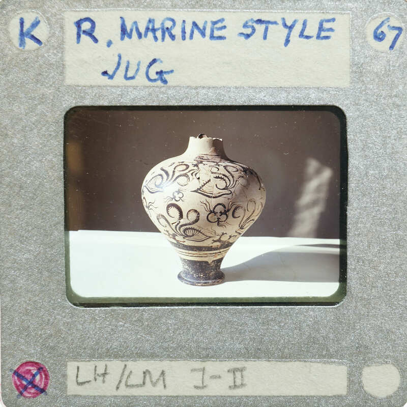 Full jug with tentacle design on table.