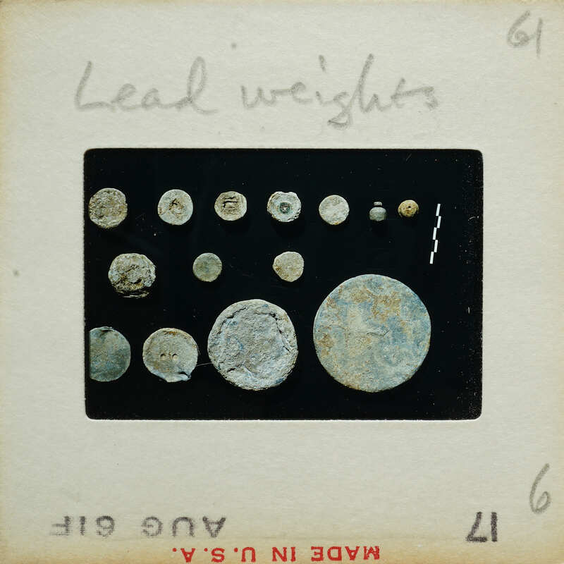 Circular lead pieces on a surface.