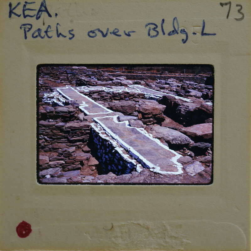 A photograph of a stone bridge with graffiti on the film strip.