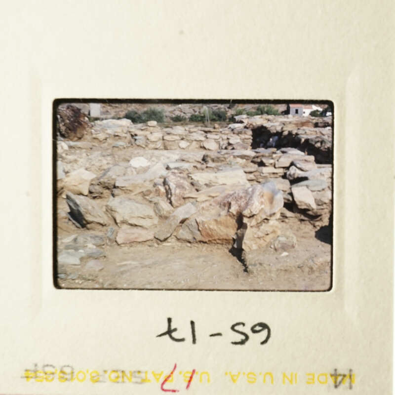 This is an image of a rocky landscape with a few scattered rocks and a clear sky above.