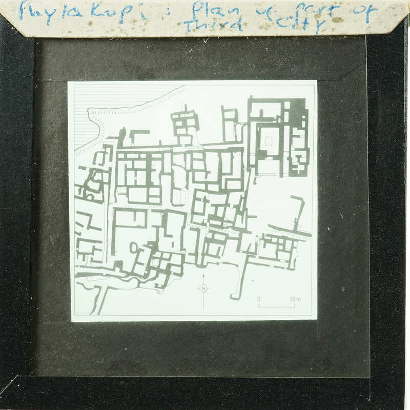 Black and white map of an urban area with various structures, possibly from an old city plan.