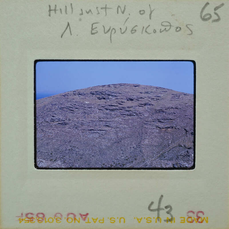 A black and white photo of a rocky hillside with annotations on the border.