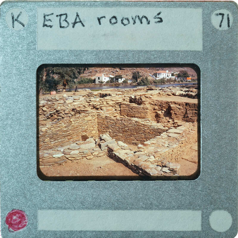 Excavated stone walls in various directions forming rooms.