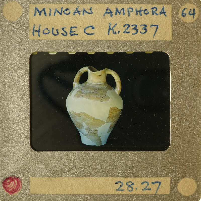 Ancient Greek vase with detailed artwork on display.