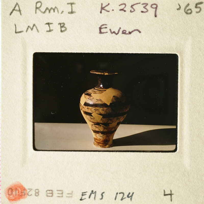 A photograph of an ancient vase with intricate patterns.