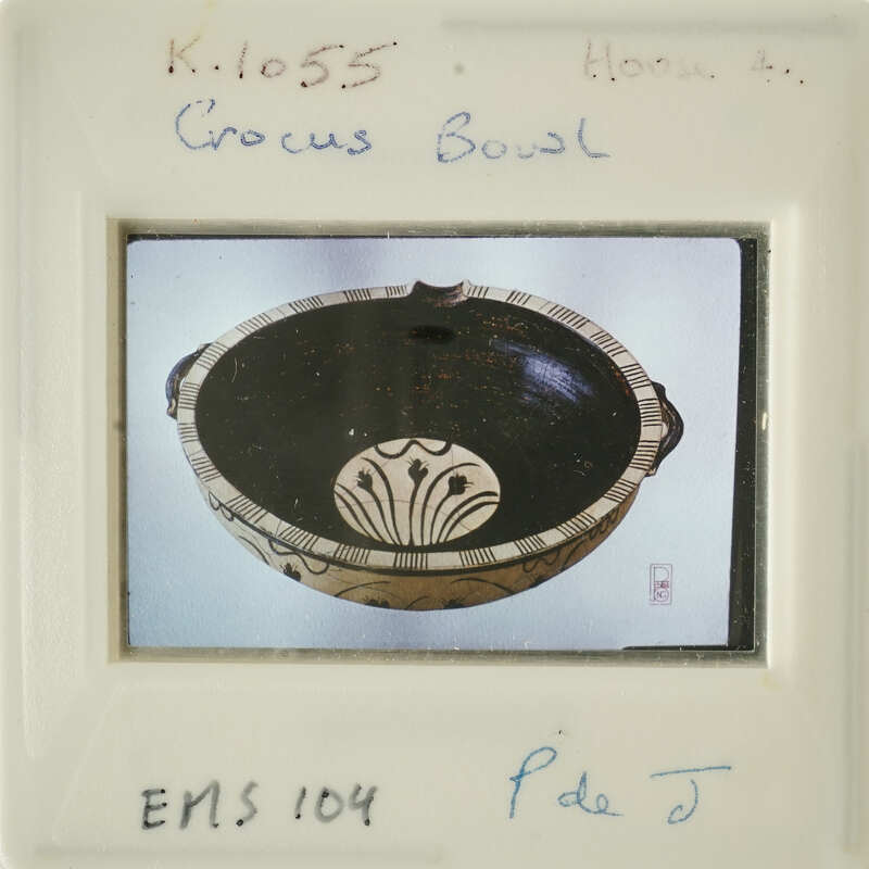 Ancient Greek bowl with intricate designs on display.