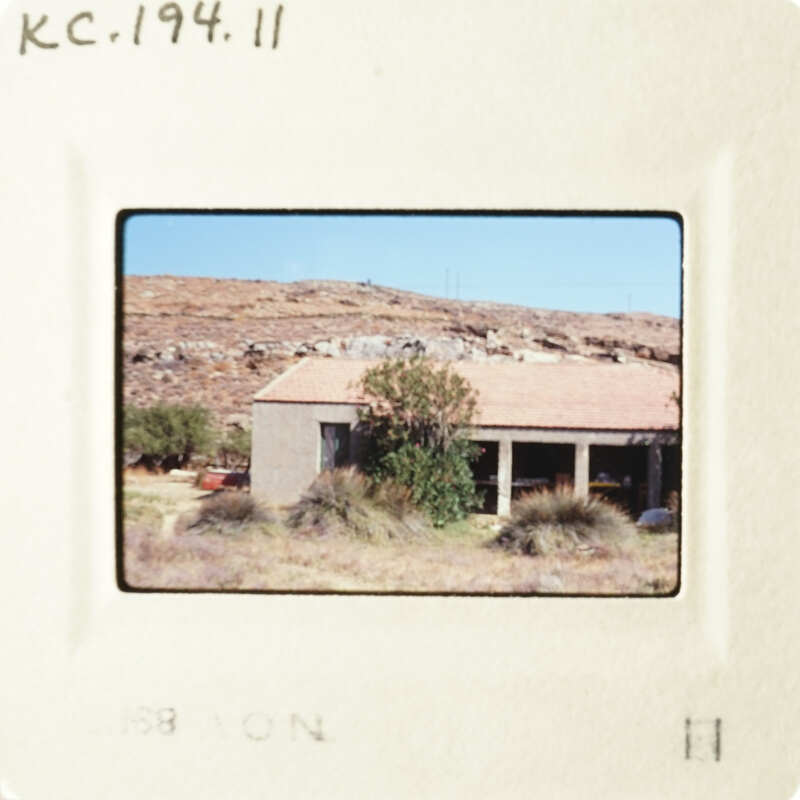 A house with a clear blue sky in the background.